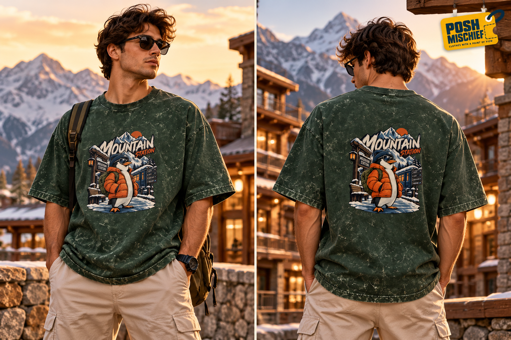Adult model wearing the Bottle Green Mountain Station Penguin acid-wash oversized T-shirt, front and back outdoor fashion view