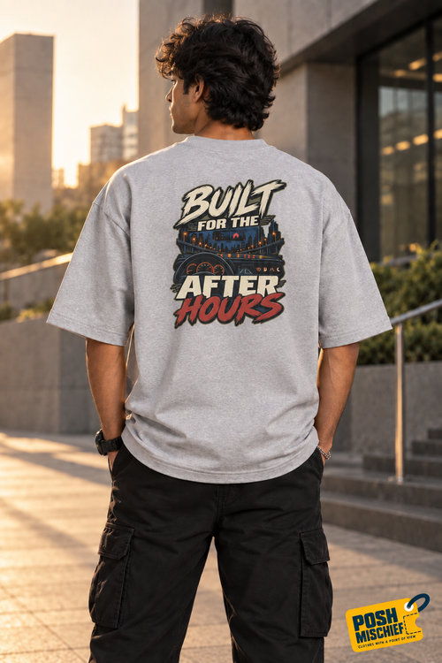 Outdoor back view: Indian model wearing the Grey Melange Built for the After Hours oversized T-shirt