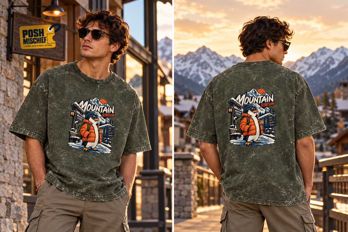 Adult model wearing the Olive Green Mountain Station Penguin acid-wash oversized T-shirt, front and back outdoor fashion view